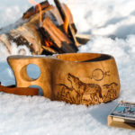 Kuksa is a traditional Lappish wooden mug. This one is decorated with an image of a howling wolf.